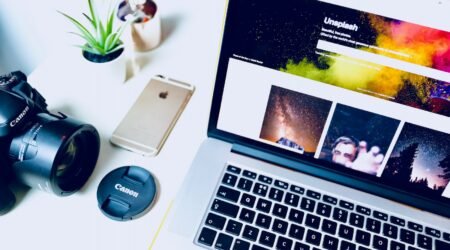 turned on MacBook Pro near rose gold iPhone 6s